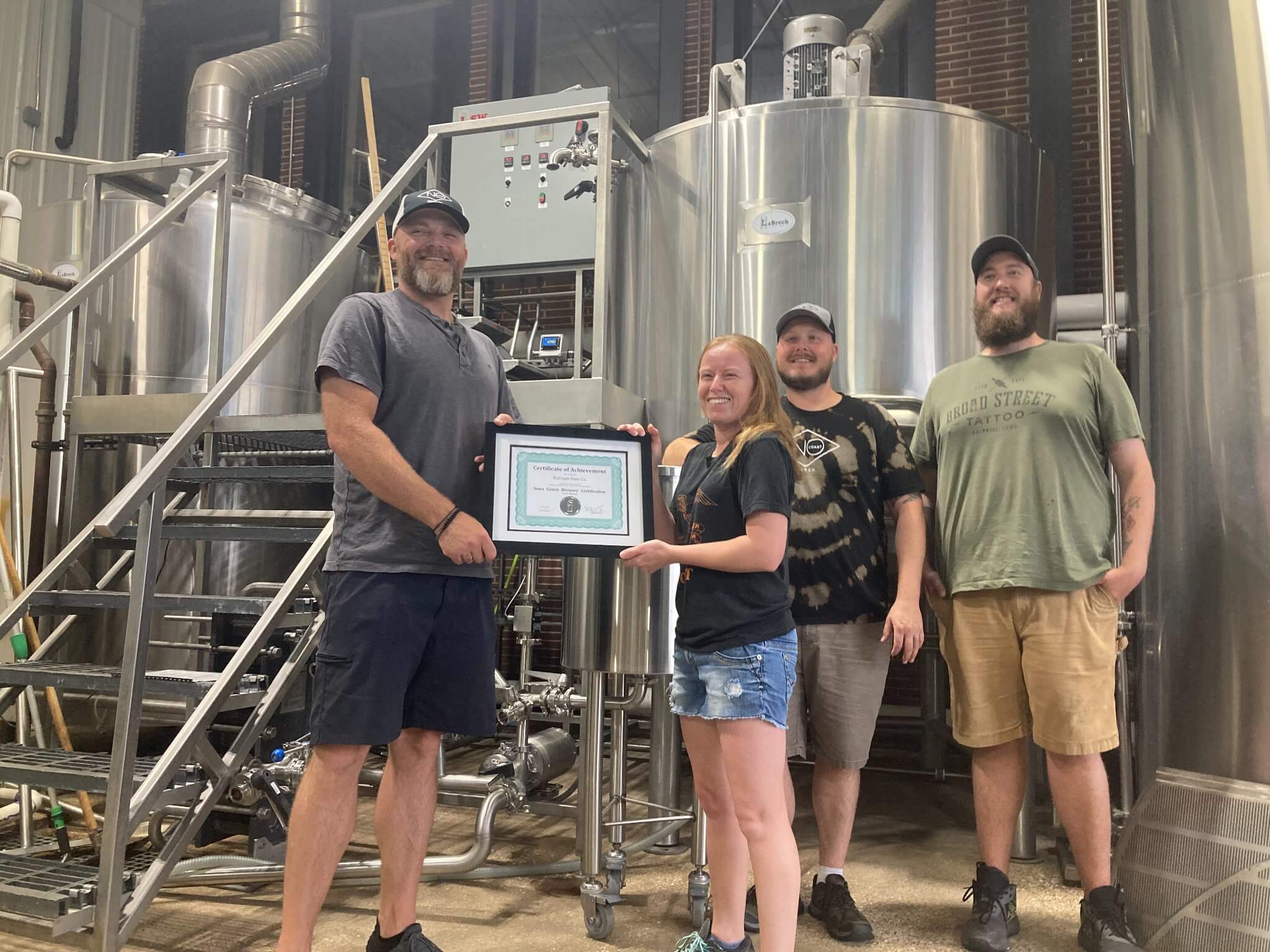 IWRC Director Joe Bolick awards NoCoast Beer Co their Platinum Certification