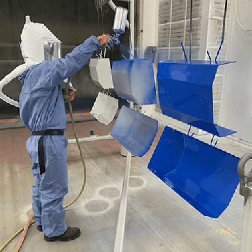 Link, student practices paint application on auto part