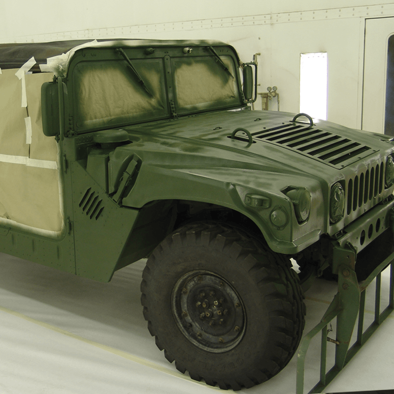 Link, military vehicle sits in paint spray booth