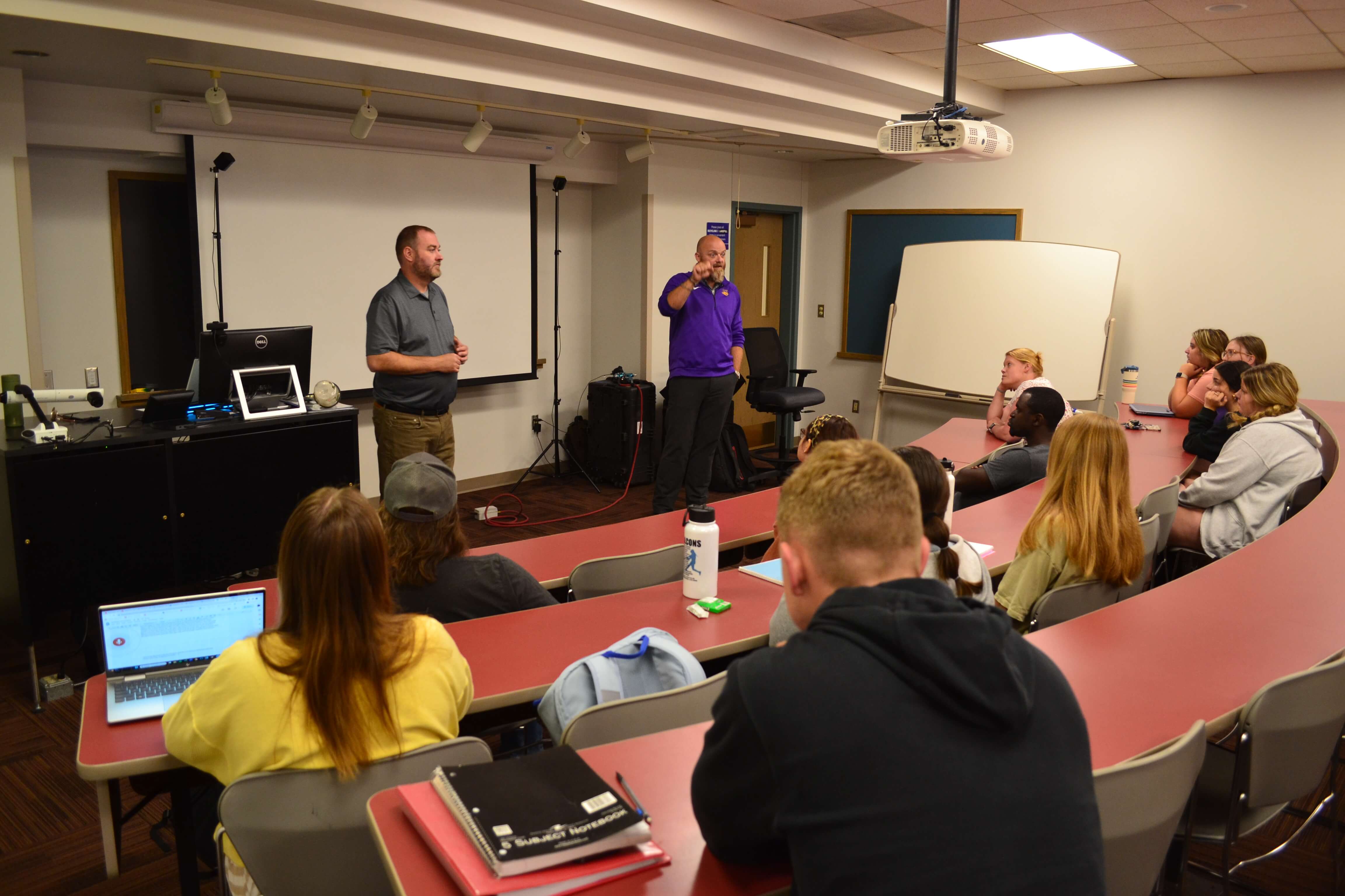 STAR4D instructors discussing programming to class of UNI students