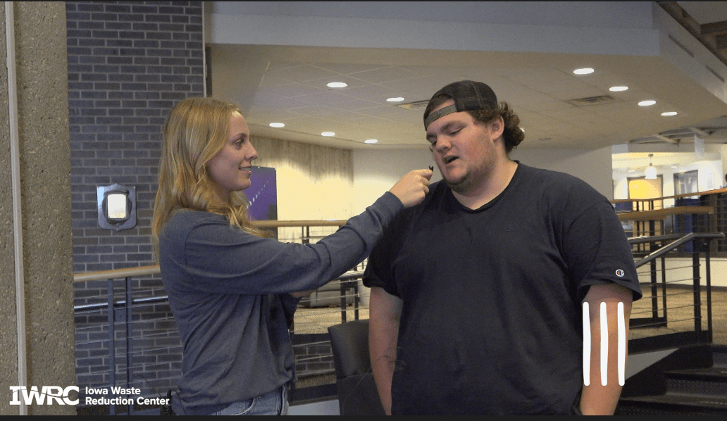 Kendall Lienemann interviews male UNI Student about clothing waste.