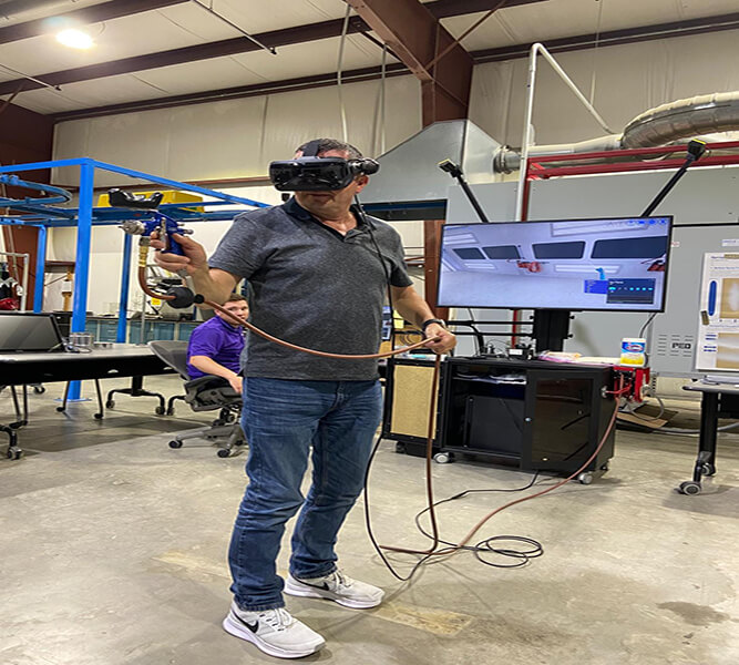 man training on VirtualPaint system for painter training recertification at STAR4D