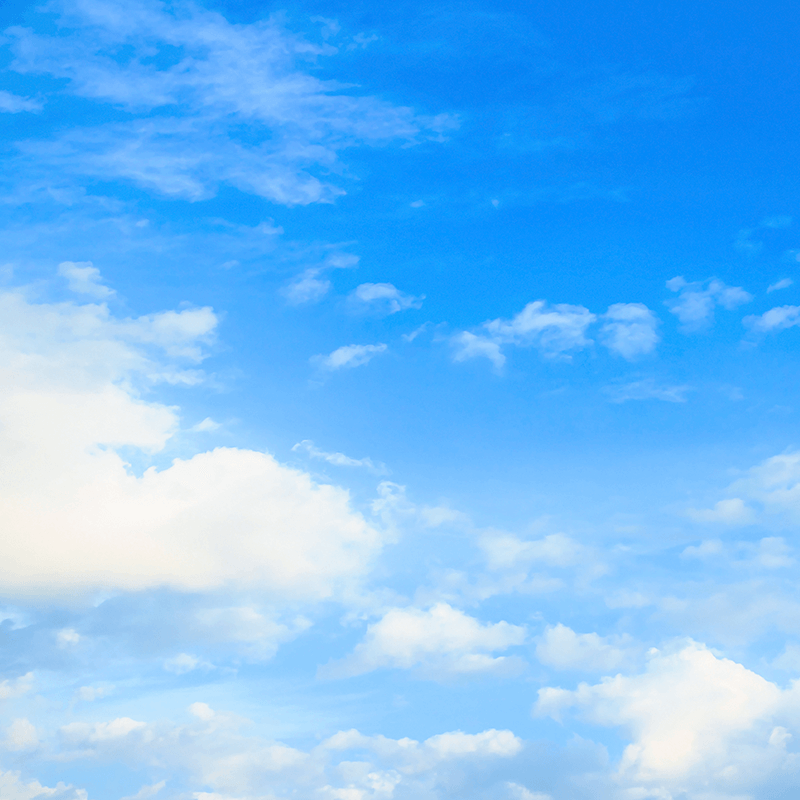 Link, blue sky filled with fluffy white clouds